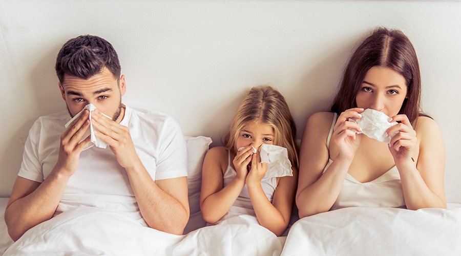Family in Bed with Colds