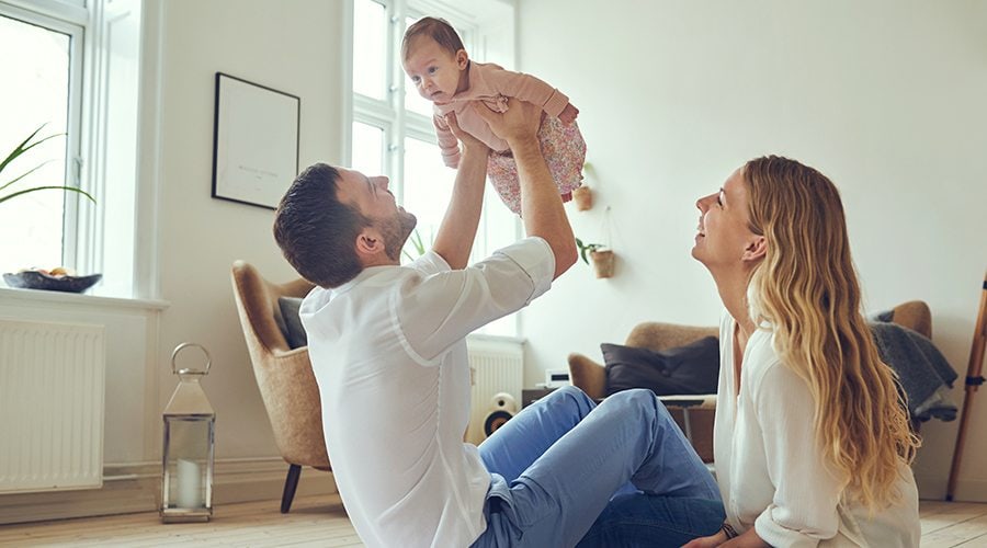 Family in Living Room Playing with Baby