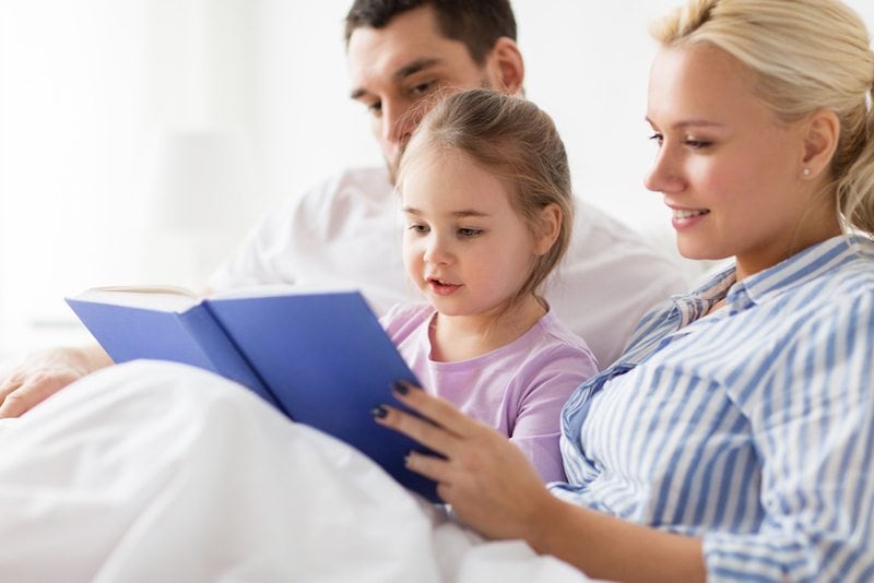 A family reading about an air conditioner preventing mold in Wausau